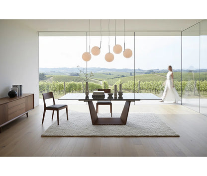 Contemporary Extendable Smoked Tempered Glass Dining Table with Sculptural Angled Wood Pedestal Base, Seats 6–10